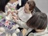 Participants help each other to craft the pot diffusers. 