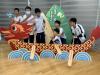 Students learn how to paddle on a dragon boat. 