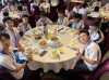 Students are enjoying lunch on the first day of their Dongguan study tour, making lasting memories around the table.