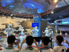 Captivated by the robotic performance at the Dongguan Science and Technology Museum, students are capturing the moment where technology and creativity converge during their exploration.