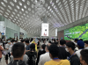 Students at Shenzhen International Airport exploring its facilities and examining the relationships and differences between the airports of Shenzhen and Hong Kong