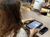 The school provide iPad for parents to learn how to use AI during the workshop. 