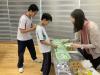 Social worker from Po Leung Kuk helps students to make the sensory bottles.