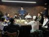 8 participants were divided into two groups to play Rummikub with each other.
