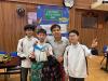 Students and teachers have a lot of fun at the Polaroid booth, where they can try on different cultural costumes.