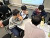 Our students listen to a volunteer from the business sector.