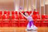 2B Fang Yin Weng is showcasing a Chinese dance performance.