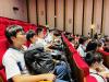 Students are listening to the presentation. 
