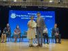 Award recipients proudly receive their prizes.