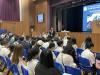 Principal Wong is delivering an opening speech to parents and students.