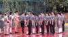 The judge inspects the students' uniform.