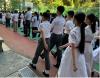 Students are using Chinese style foot drill during the flag raising ceremony.