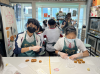 Students divide and stretch the dough to shape perfectly before putting in the oven.