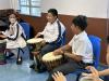 Engaging in Rhythm: Students connect through collaborative drumming sessions.
