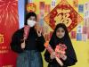NCS students dressed in traditional Chinese attire and holding props took photos!