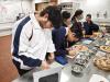 Students learn how to decorate cookies with different ingredients.
