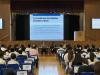 Ms. Chiu, the Vice Principal, explains the promotion criteria to students.