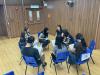 Parents have a meeting with the class teacher.
