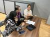 Parents are grouped and participate in an activity using AI to plan a career path.