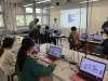 Students listening attentively in the AIoT workshop.