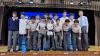The football team proudly receives their well-deserved prize, celebrating a season of hard work and teamwork.