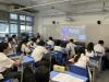 Teacher was watching the live broadcast with students.