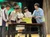 The guest is inviting some students to try the tools.