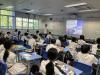 Students listen attentively to the presentation. 