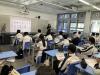 Students read a handout about AI-driven changes in career planning. 