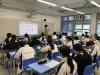 Students listen attentively to the presentation. 
