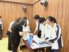 Student helpers eagerly assisted and welcomed parents at the reception desk.