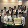 The award-winning group are posing for a happy photo with the model of their ideal Sham Shui Po District.