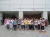 Students and teachers take a photo in front of Shenzhen Museum.